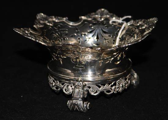 A Continental (probably Dutch) white metal pierced shaped bowl on scrolled feet.